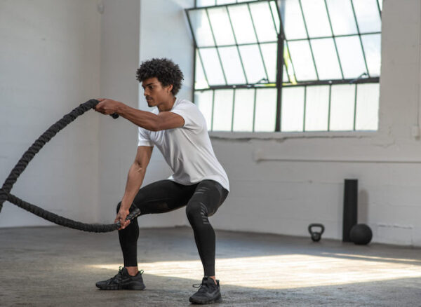 stoko-benefits man exercising with two ropes