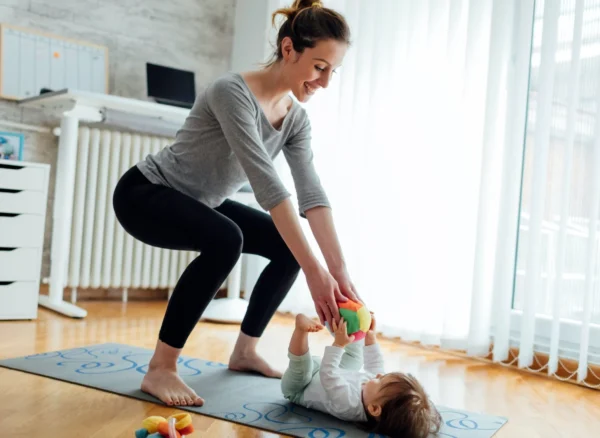 Post Partum Physiotherapy Baby Woman doing post partum physiotherapy with her baby
